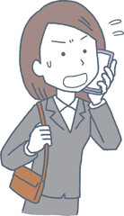 焦って電話をする女性