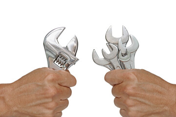 Hand Holding Adjustable Wrench and Several Size of Spanners illustrated the Multitasking versus...