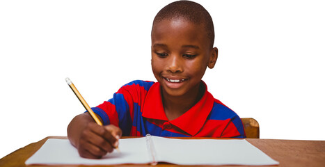 Digital png photo of african american schoolboy writing in notebook on transparent background