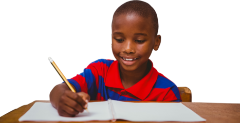 Digital png photo of african american schoolboy writing in notebook on transparent background
