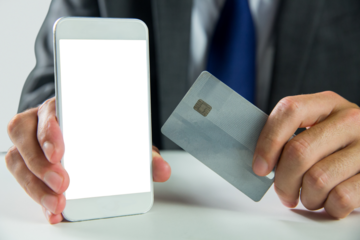 Digital png illustration of hands holding smartphone, copy space on transparent background