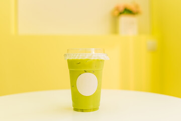 A cup of Thai green tea milk tea on the table