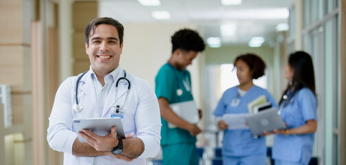 Portrait of male professor doctor holding tablet hanging stethoscope have group students on...