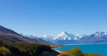 Cercles muraux Aoraki/Mount Cook Landscape view of  mountain range near Aoraki Mount Cook and the road leading to Mount Cook Village in New zealand