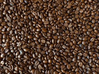 Roasted coffee beans stacked abstract background Aromatic bitter coffee that is popular to eat in the morning to feel refreshed. cure drowsiness.