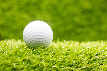 Golf ball is on green gras
