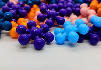 Building Blocks background. Connect Toys, Interlocking Solid Plastic Stem creative blocks on white background. Colorful Building Blocks background for design.
