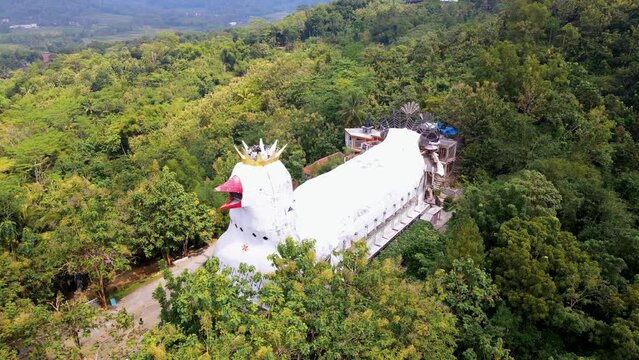 Random huge chicken church temple on Rhema forested hill in Yogyakarta, Indonesia. Aerial view