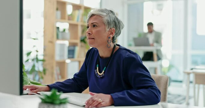 Business, computer and confused senior woman in office with scam alert, phishing or glitch. Online, error and elderly female ceo checking email, notification or warning for hacker, problem or fail