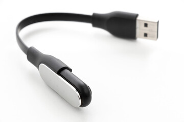 Fitness bracelet, pedometer with charger USB, watch on a white background