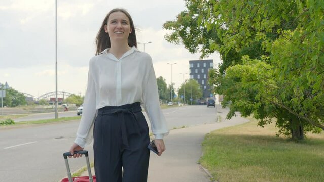 Entrepreneur woman travelling for business, walking front view