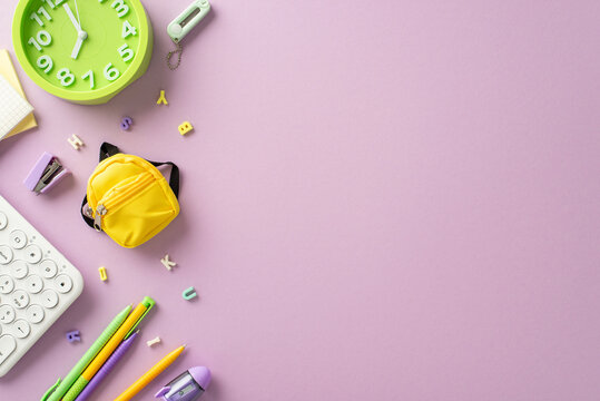 Dive into the realm of distant learning with this compelling top-down picture showcasing a keyboard and pastel stationery on a soft purple backdrop. Customize the copy-space with text or promotion