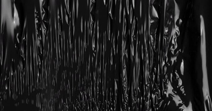 Explore captivating allure of beautiful abstract background shrouded in darkness, showcasing glossy polyethylene texture reminiscent of a mystic black hole, offering ample space for text elements.