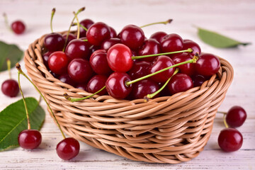 Fototapeta na wymiar Ripe cherries in a basket on the table.Close-up. 