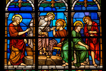 Obraz na płótnie Canvas Vivid Minimalist Stained Glass style scene of John 13:5 Bible verse, depicting humble act of foot washing by Jesus aglow with divine fervour. Generative AI