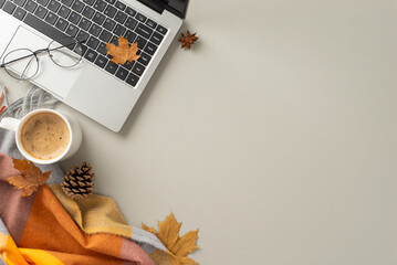 Autumn-themed desk arrangement. Top view of laptop, cup of fragrant coffee, spectacles, comfortable...