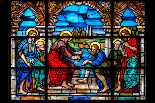 Captivating multicolored stained glass artwork in Catholic church depicting feet washing scene from John 13:5, New Testament - ideal for catechetical teachings. Generative AI