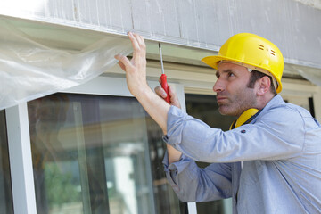 male builder working on door lintel