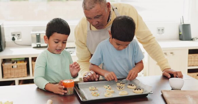 Cookies, home and grandfather baking with kids for sweet treats, dessert or snack in the kitchen. Equipment, ingredients and senior man teaching grandchildren cooking with dough for biscuits at house