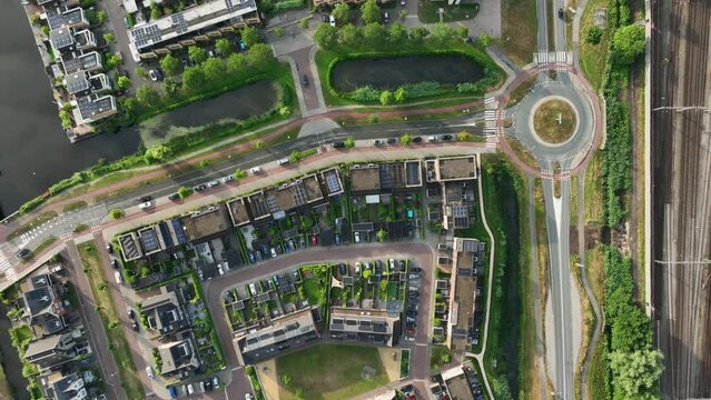 Unique layout of housing projects in Weesp between canals, aerial top-down