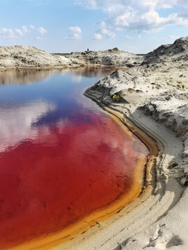 Red water in the lake. Phosphoritny settlement of the Moscow region, Russia