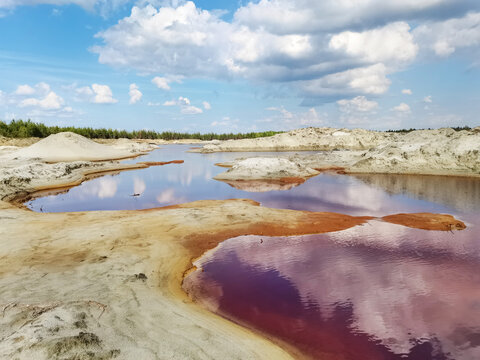 Red water in the lake. Phosphoritny settlement of the Moscow region, Russia