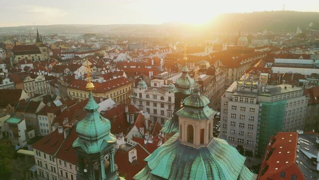Aerial View of the Old Church and Domes with a View of the Old Town of Prague. Drone Shot of the Praha Downtown. Tourism and Traveling Concept