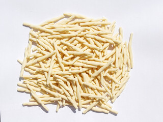 Close-up of Trofie pasta, a speciality from Genoa in Italy, on a white background