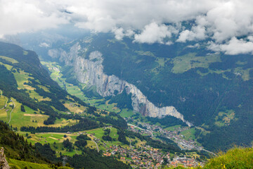 Fototapeta na wymiar view from Männlichen through clouds into Lauterbrunnen valley