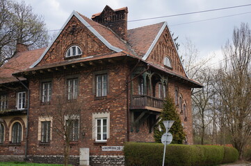 Fototapeta na wymiar Former building of the outpatient clinic from 1904 in Ostrowy Gornicze, referring to Zakopane style. Sosnowiec, Poland.
