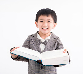 Happy kid holding and studying book