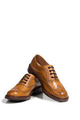 Pair of Tanned Brogue Derby Shoes Made of Calf Leather with Rubber Sole Isolated Over Pure White Background.