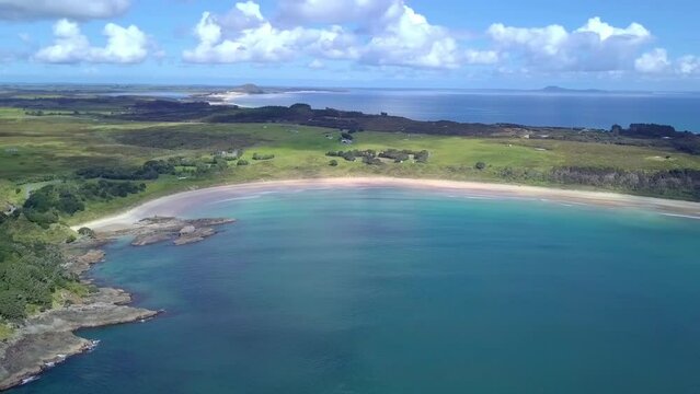drone revealing shot from the Maitai Bay exposing the Waikato Bay at Karikari Peninsula in New Zealand