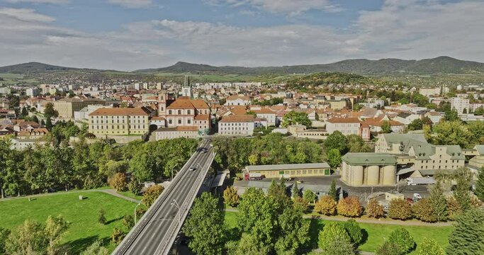 Litomerice Czechia Aerial v1 flyover Elbe river along the bridge towards town center capturing charming townscape, All Saints church and hillside landscape - Shot with Mavic 3 Cine - November 2022