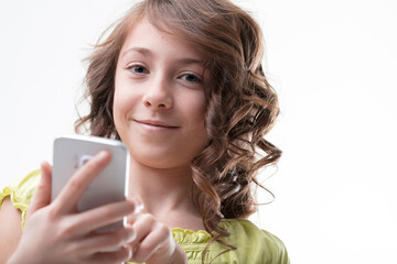 Girl confidently uses smartphone, symbolizes digital natives