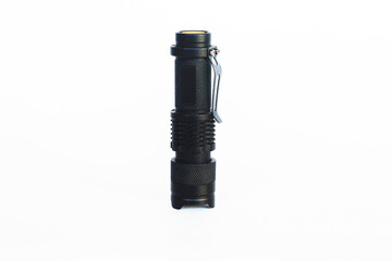 Black tactical flashlight. Outdoor flashlight isolated on white background