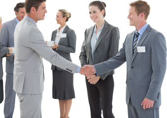 Digital png photo of smiling caucasian business people shaking hands on transparent background