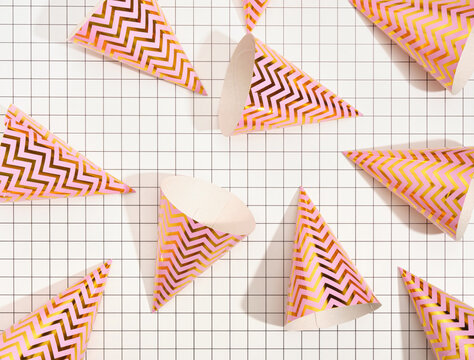 Top view of the festive brightly colored hats. Atmosphere of holiday and colorful mood.