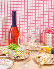 A bottle of celebratory champagne and two glasses. Romantic celebrate dinner or lunch.