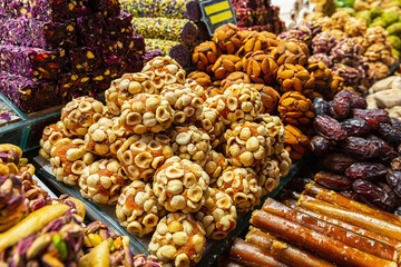 Turkish sweets with hazelnuts, almond and nougat. Sweets and traditional oriental delights concept. Street bazaar, Istanbul, Turkey