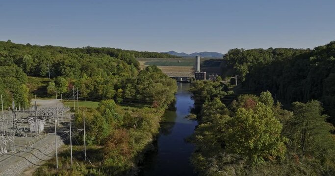 Blue Ridge Lake Georgia Aerial v5 drone flyover along Toccoa river towards the dam capturing beautiful lake surrounded by mountain landscape and lush greenery - Shot with Mavic 3 Cine - October 2022