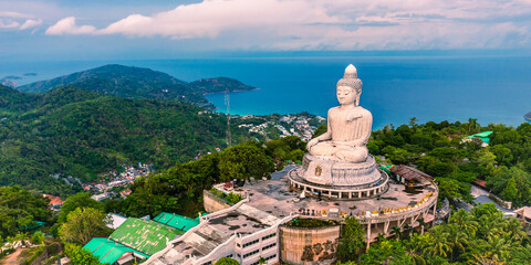 Phuket white Big Buddha statue on blue sky background. Aerial view of Big Buddha viewpoint at sunrise in Phuket province, Thailand. - obrazy, fototapety, plakaty