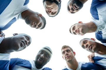 Digital png photo of diverse male rugby players teaming up on transparent background