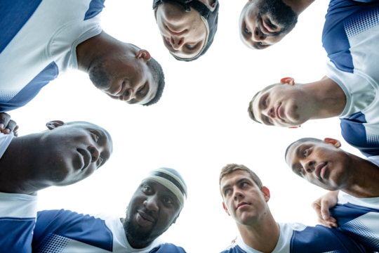 Digital png photo of diverse male rugby players teaming up on transparent background