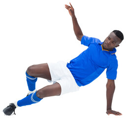 Digital png photo of african american footballer ready to kicking ball on transparent background