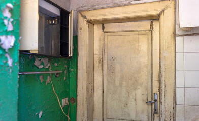 Grunge weathered mossy wooden door