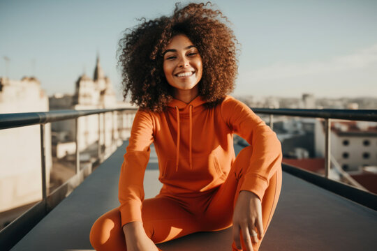 Generative AI illustration of cheerful young female in casual clothes with curly hair smiling and looking at camera while sitting by railing outdoors