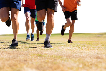 Obraz premium Digital png photo of caucasian male soccer players running at stadium on transparent background
