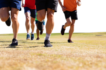 Digital png photo of caucasian male soccer players running at stadium on transparent background