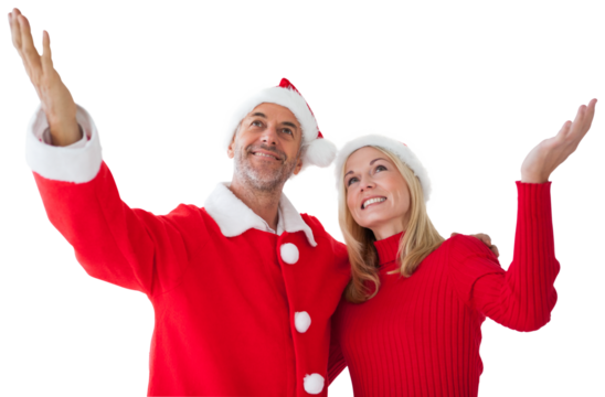 Digital png photo of happy caucasian couple in santa hat at christmas on transparent background